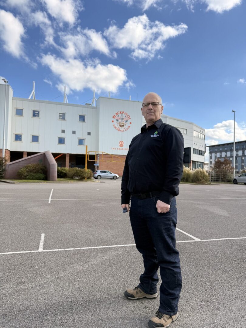 John Holt standing outside of Blackpool Football Club